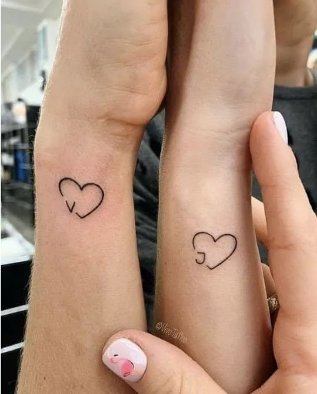 Initials and heart tattoos
