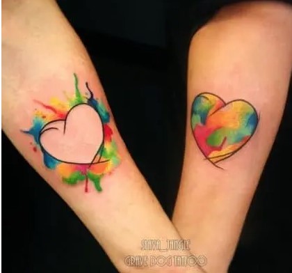 Lesbian couple heart tattoos