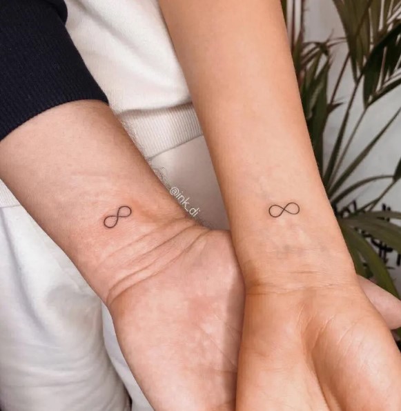 Matching infinity symbols tattoos